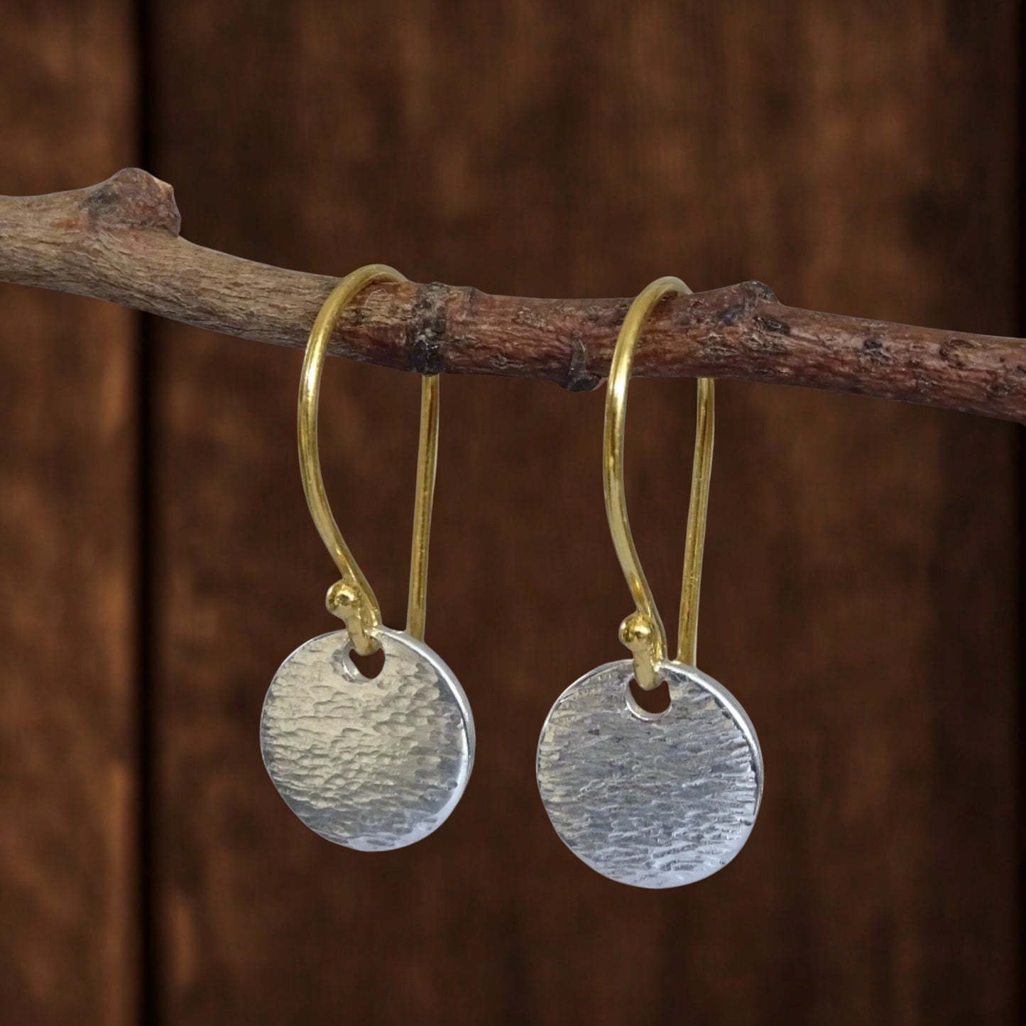 Hammered sterling silver disc and gold vermeil ear wire earrings.