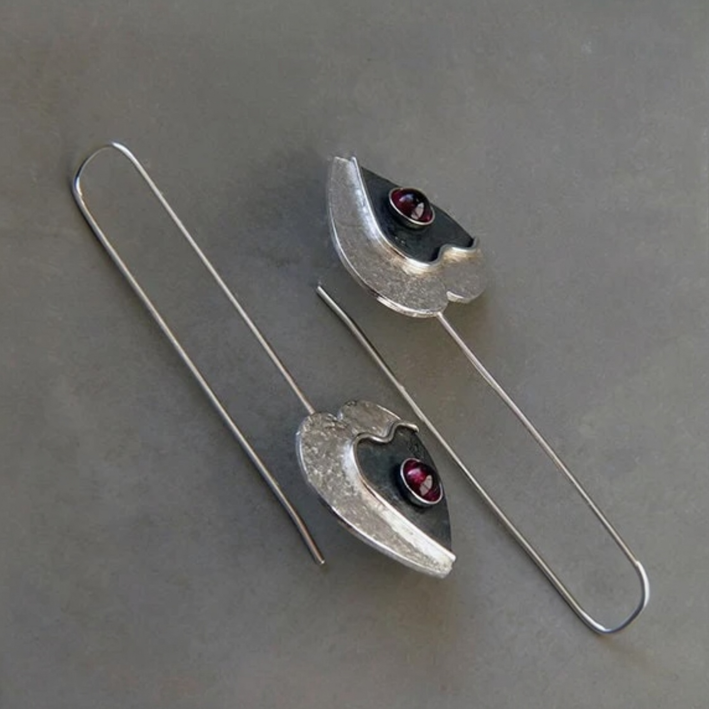 Garnet sterling silver heart earrings.