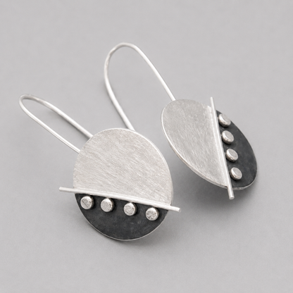 Large sterling silver disc earrings.