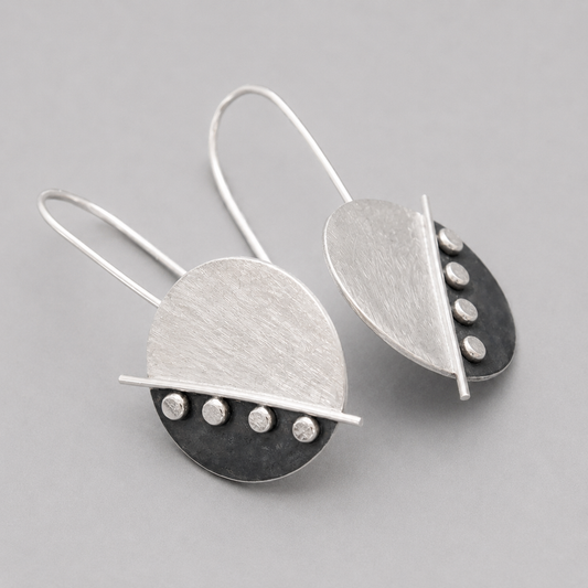 Large sterling silver disc earrings.