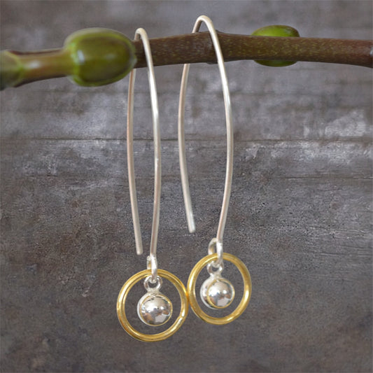 Ball and circle sterling silver and 24k gold vermeil dangle earrings.