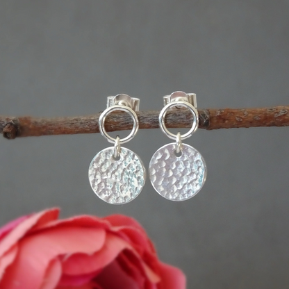 Sterling silver circle and hammered disc stud earrings.