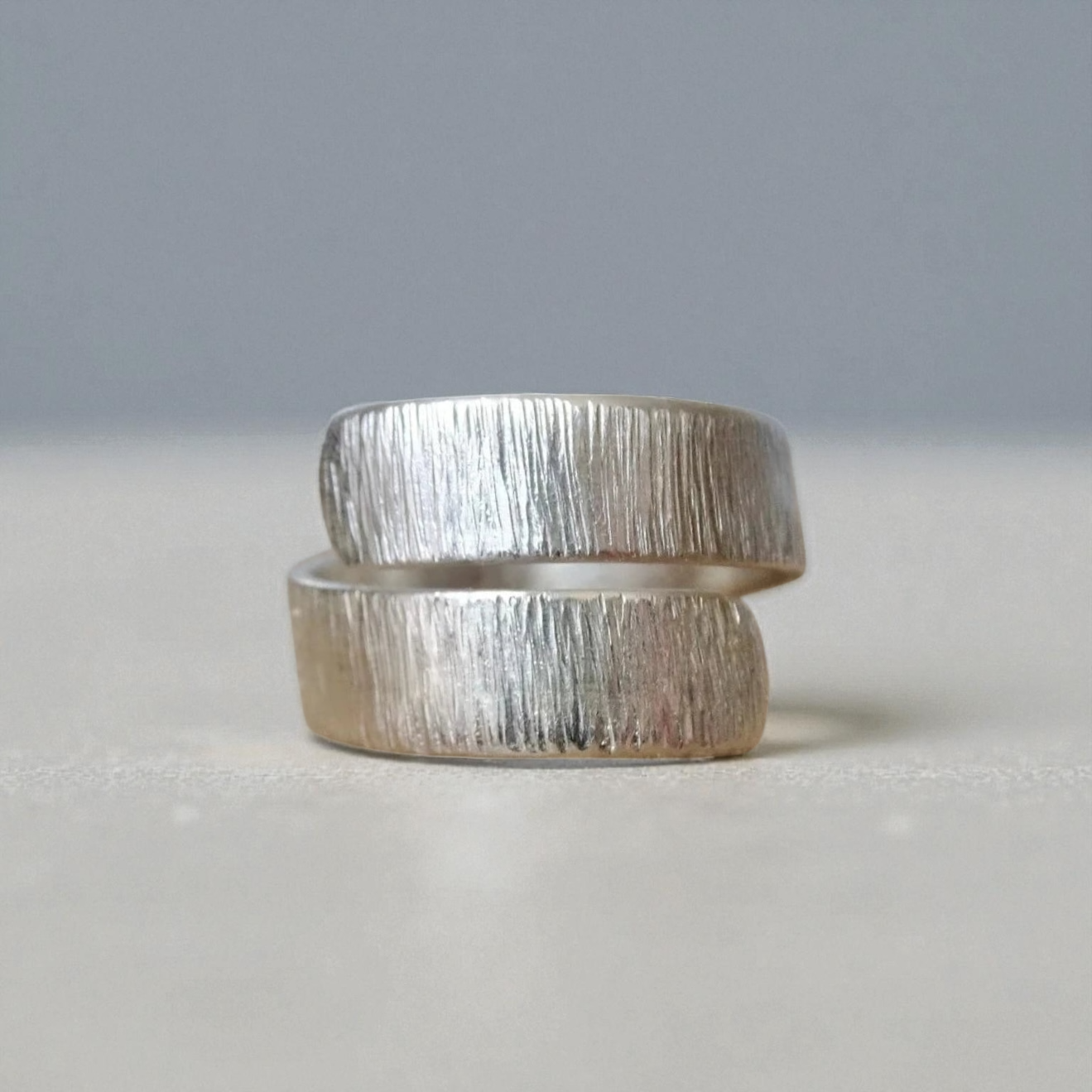 Sterling silver adjustable wrap textured ring.