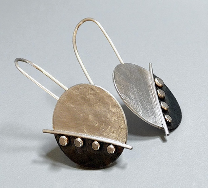 Large sterling silver disc earrings.