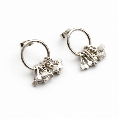 Sterling silver circle and droplets stud earrings.