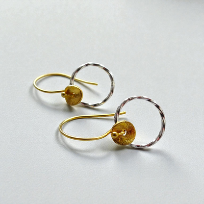 Sterling silver twisted circle earrings.