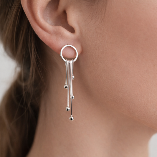 Long sterling silver circle stud earrings.