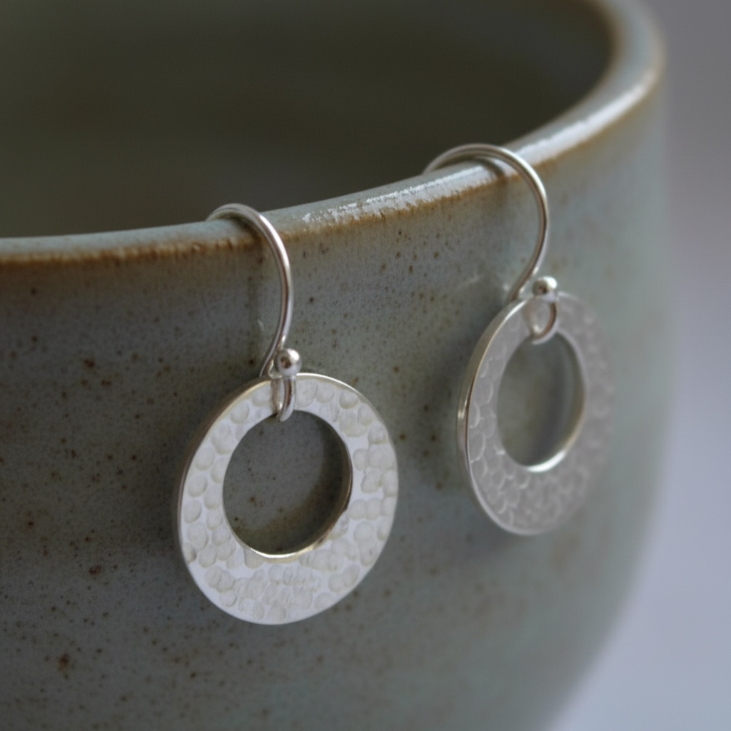 Hammered circle sterling silver earrings.