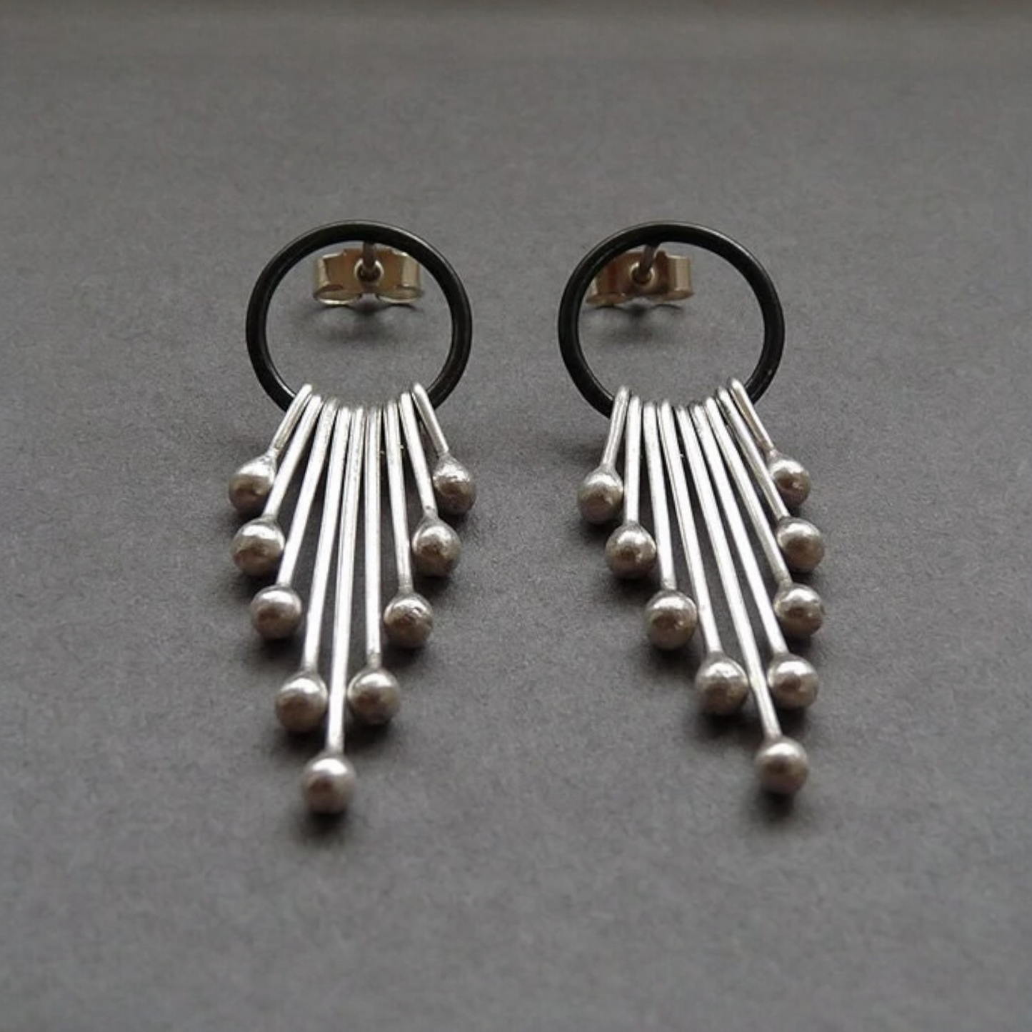 Sterling silver dangle earrings.