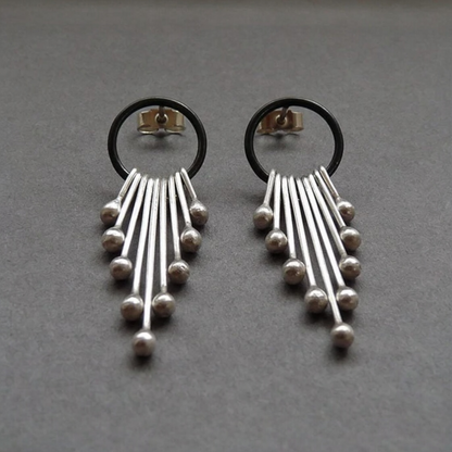 Sterling silver dangle earrings.