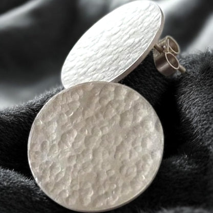 Minimalist sterling silver hammered disc stud earrings.