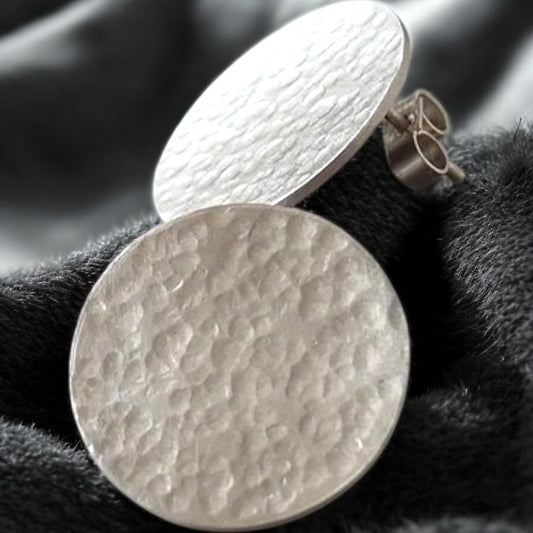 Minimalist sterling silver hammered disc stud earrings.
