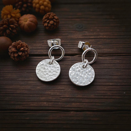 Sterling silver circle and hammered disc stud earrings.