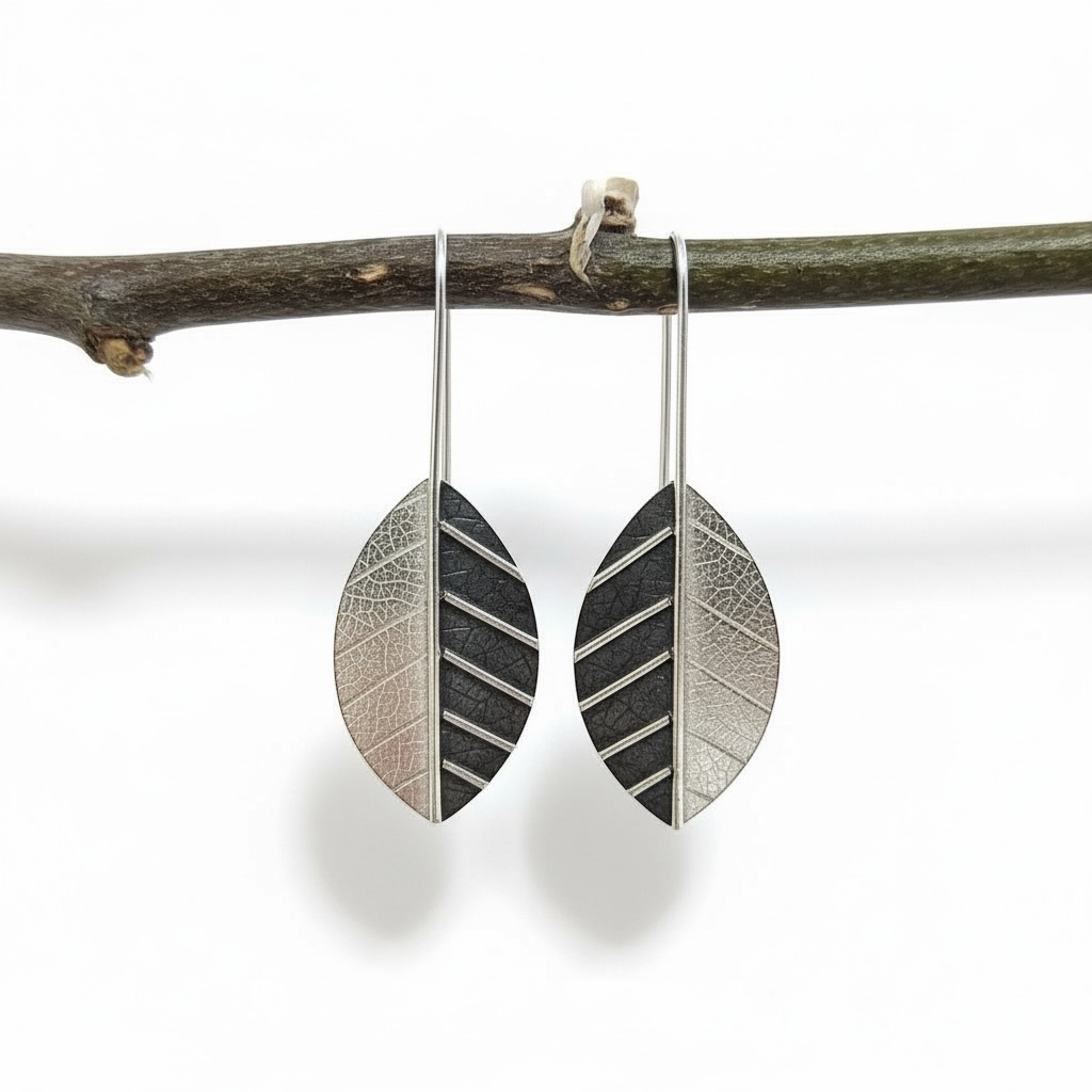 Sterling silver leaf earrings.