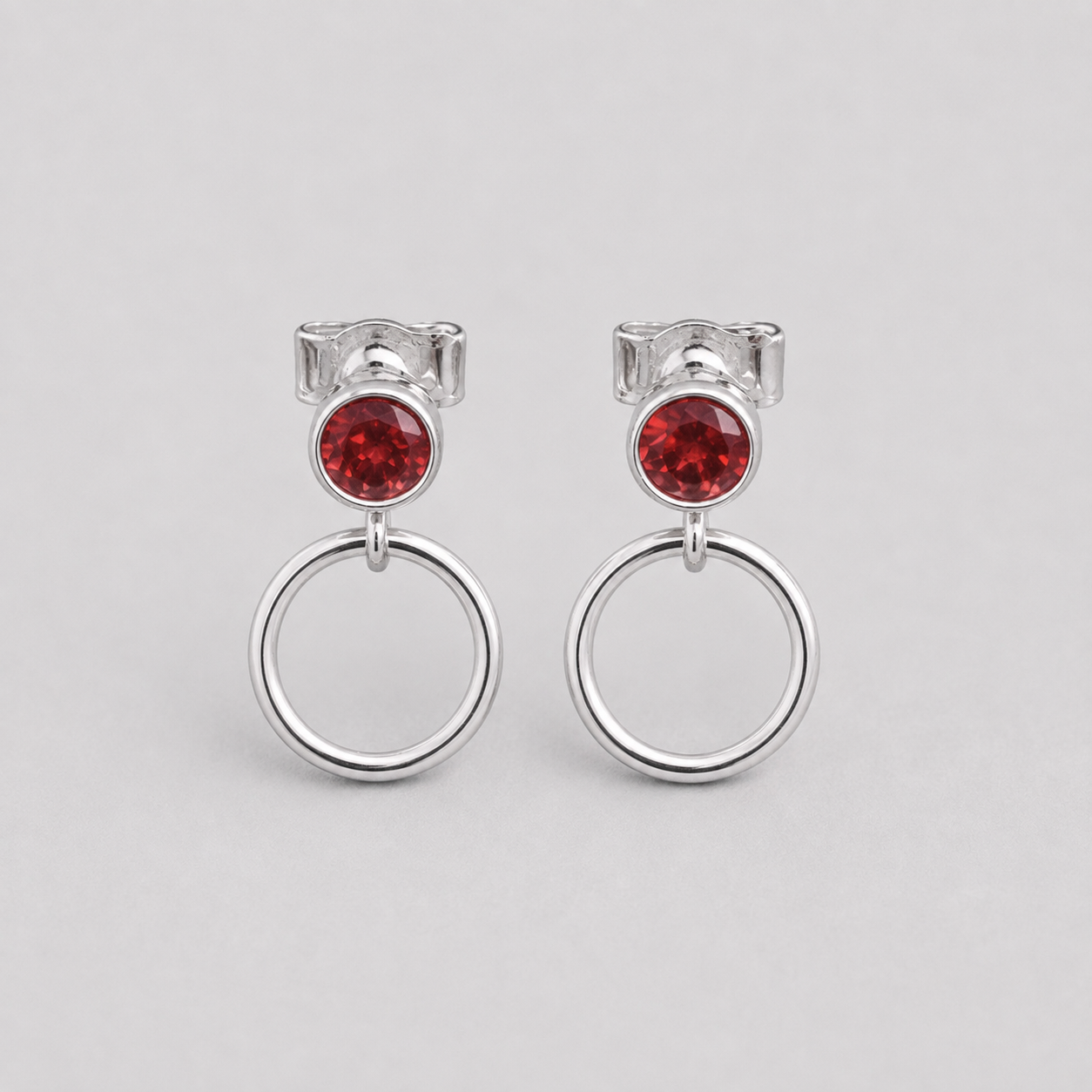 Garnet sterling silver circle earrings.