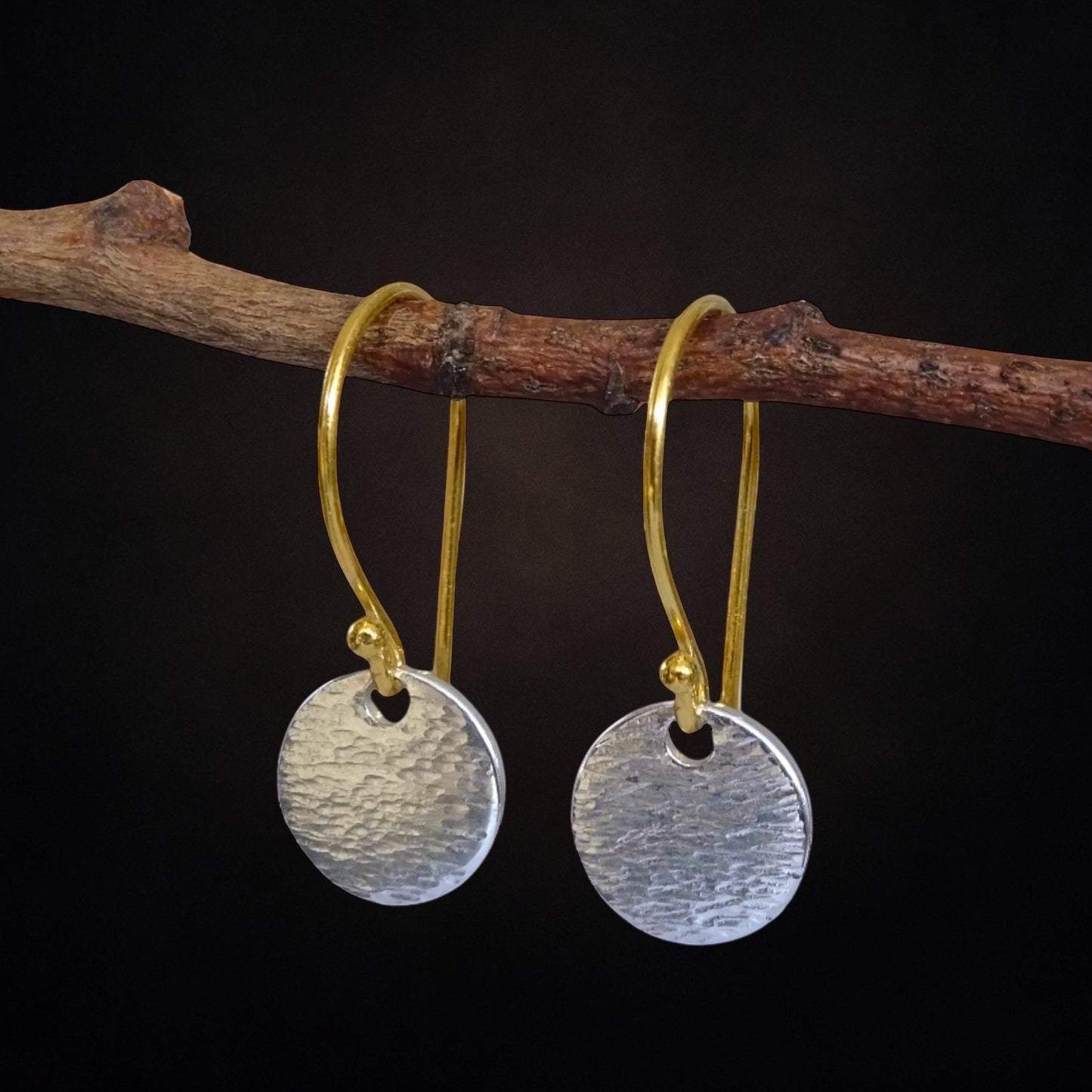 Hammered sterling silver disc and gold vermeil ear wire earrings.
