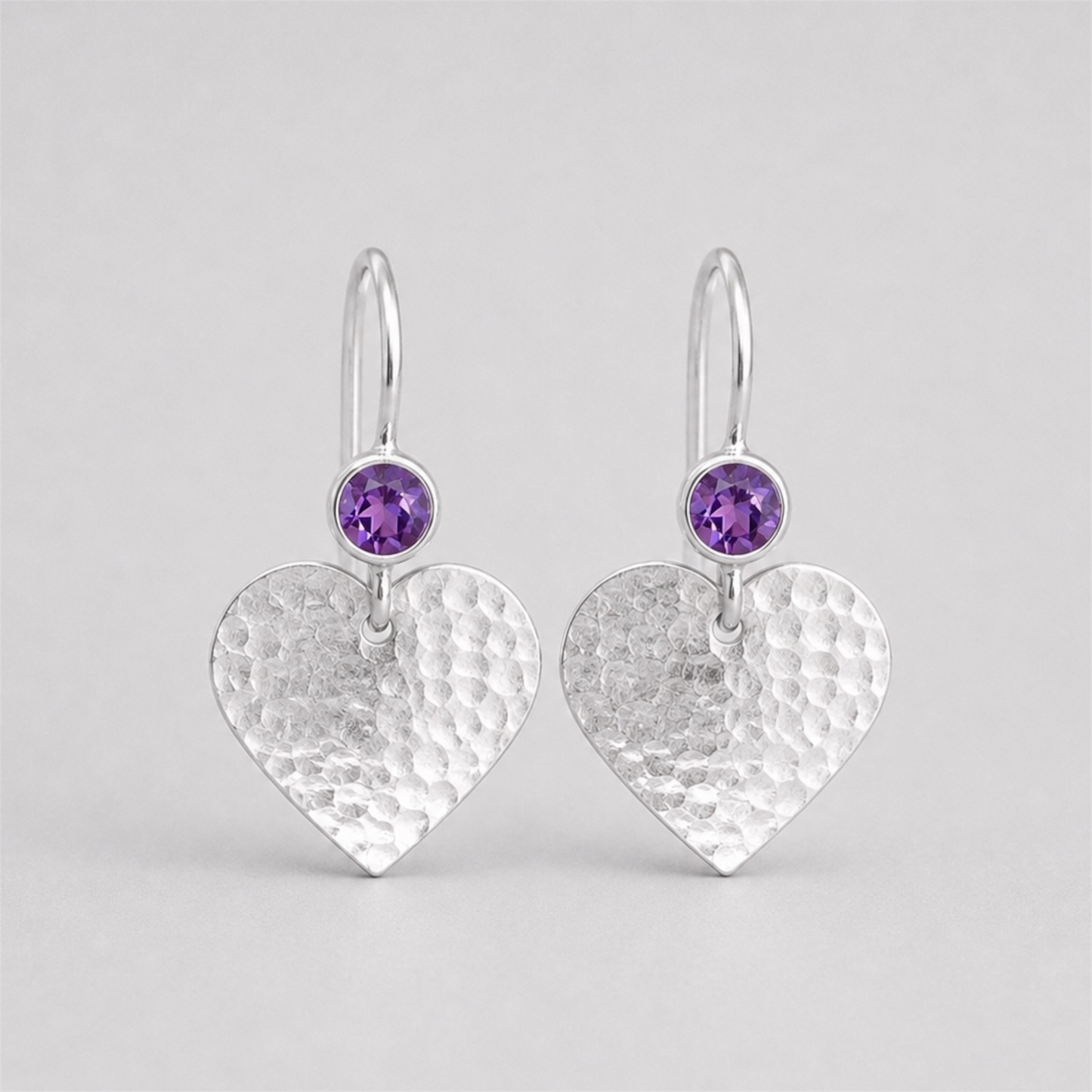 Amethyst sterling silver hammered heart drop earrings.