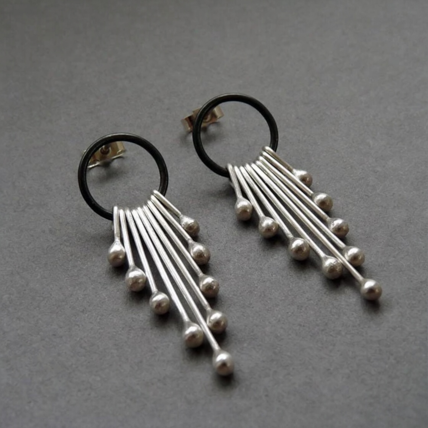 Sterling silver dangle earrings.