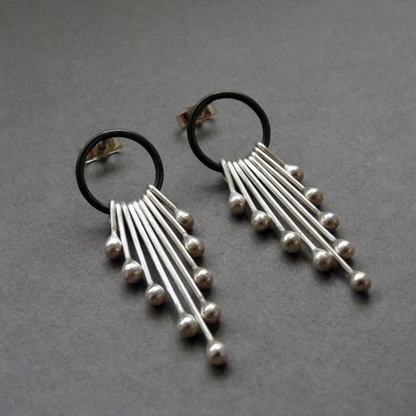 Sterling silver dangle earrings.