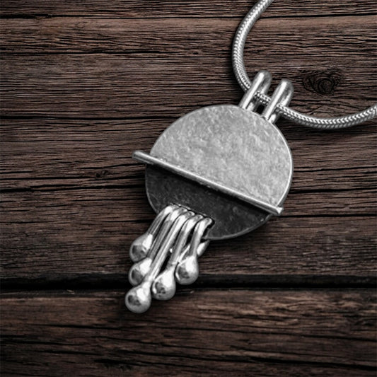 Sterling silver disc textured necklace pendant.