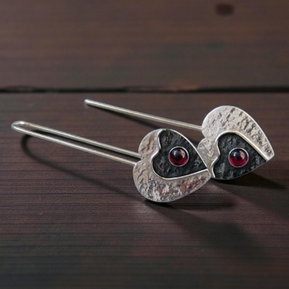 Garnet sterling silver heart earrings.