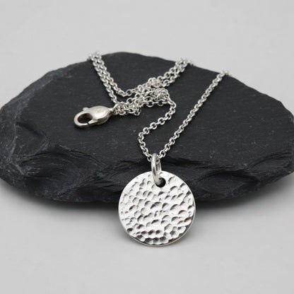 Minimalist sterling silver textured disc necklace.