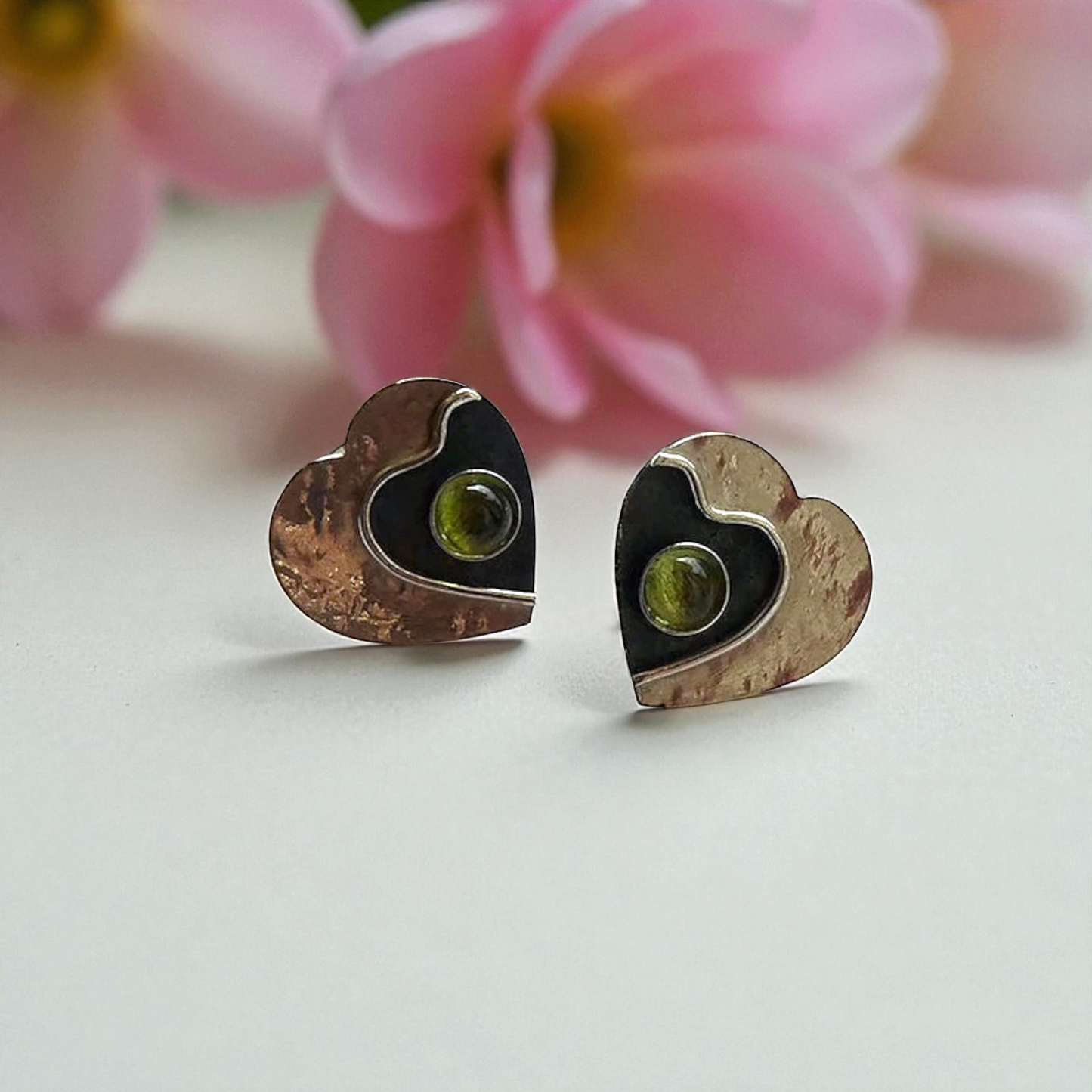 Peridot sterling silver heart stud earrings.