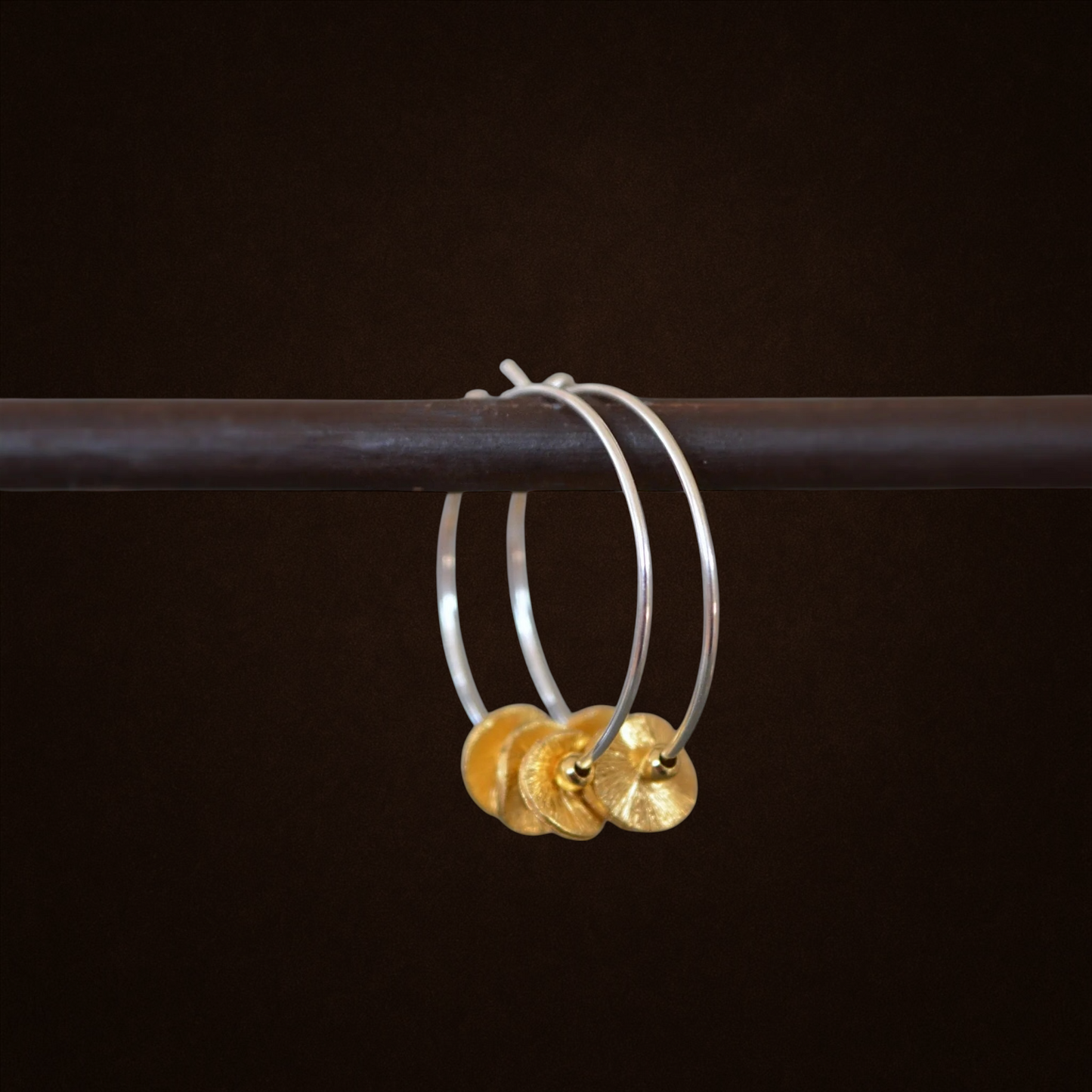 Sterling silver and 24k gold vermeil hoops.