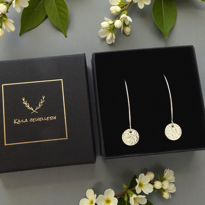 Hammerd sterling silver disc dangle earrings.