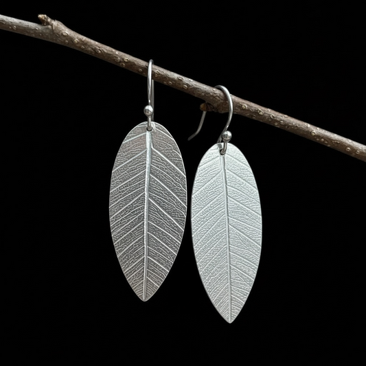 Sterling silver dangle leaf earrings.