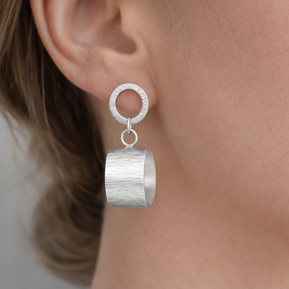 Sterling silver hammered circle stud earrings.