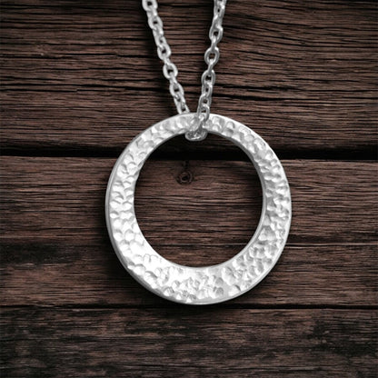 Minimalist hammered sterling silver washer necklace.