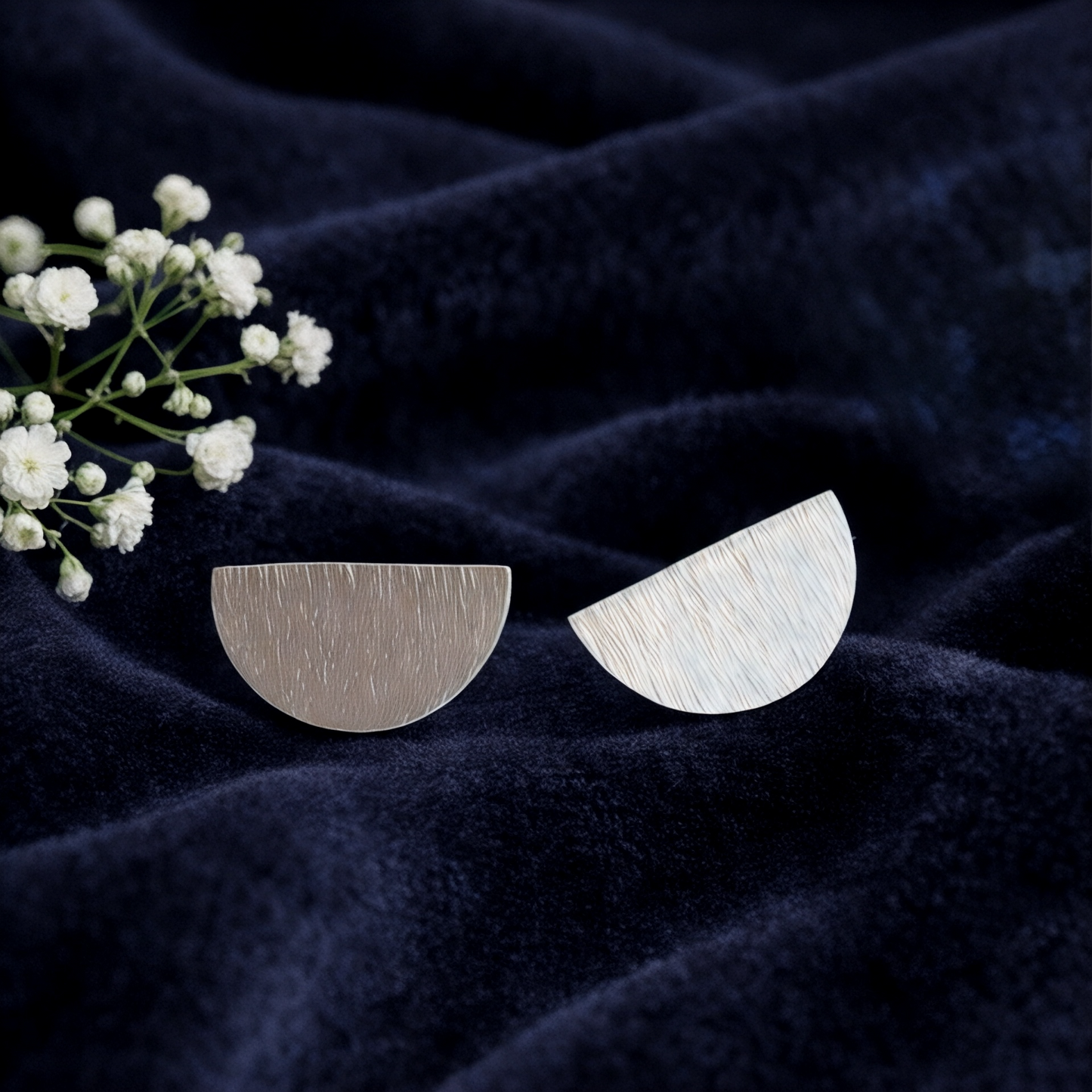 Hammered semicircle sterling silver stud earrings.