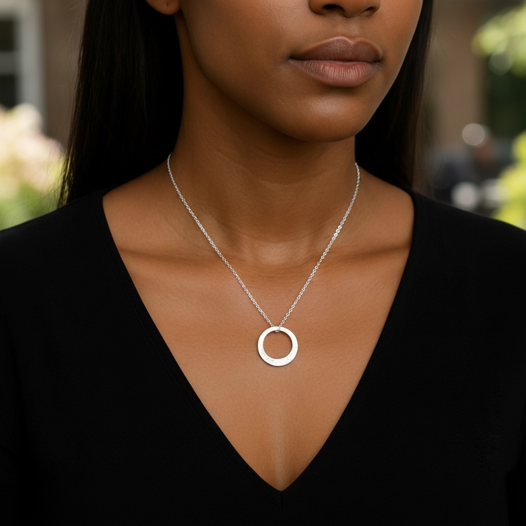 Minimalist hammered sterling silver washer necklace.