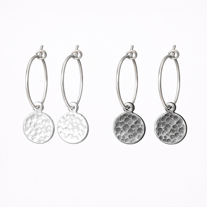 Hammered sterling silver disc charm hoop earrings.