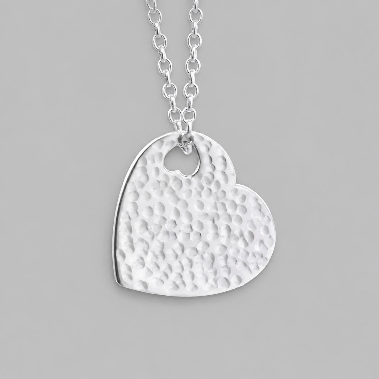 Hammered sterling silver heart necklace pendant.
