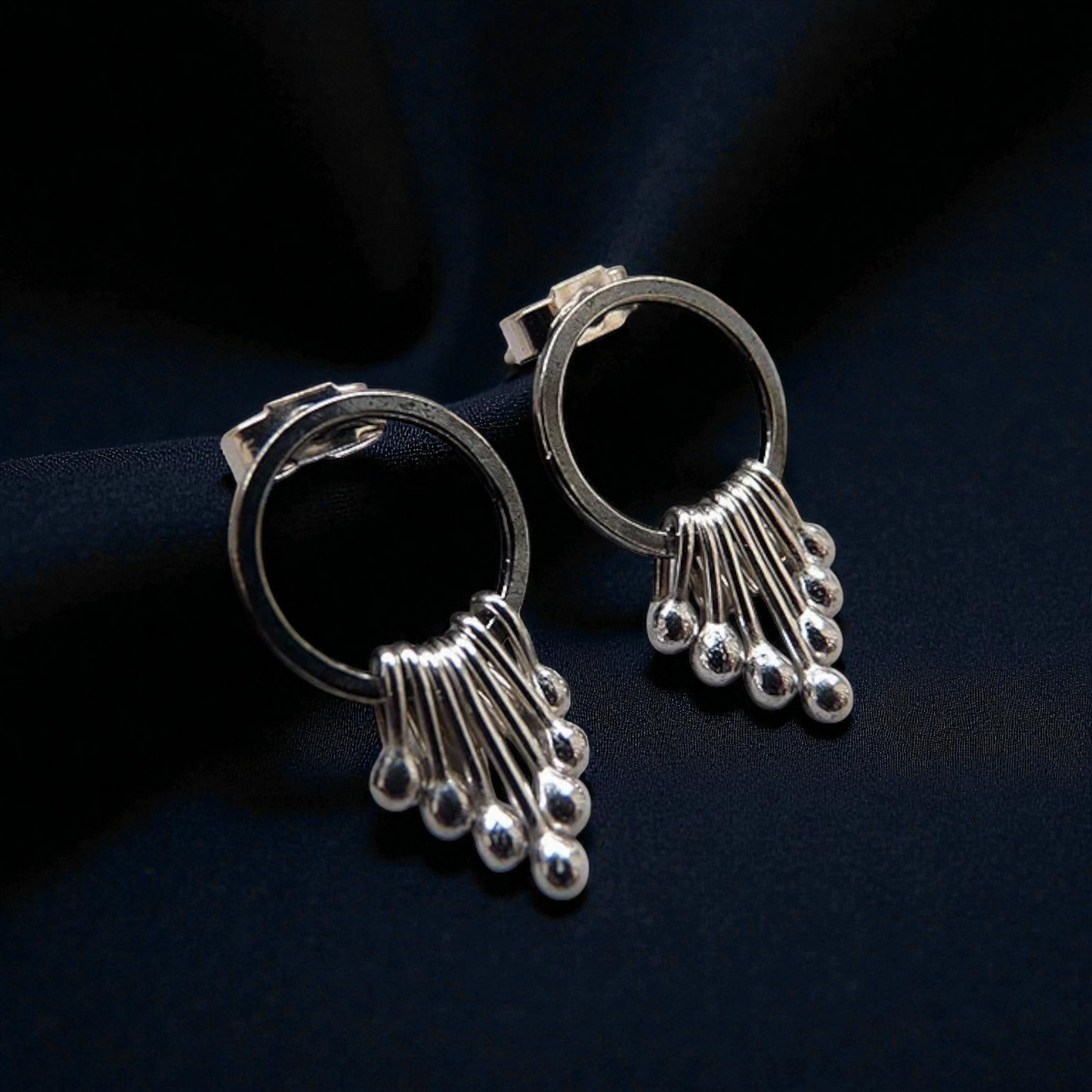 Sterling silver oxidised circle dangle studs.