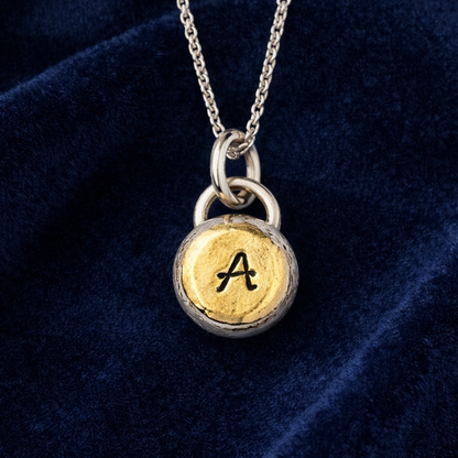 Personalised initial organic sterling silver pebble necklace.