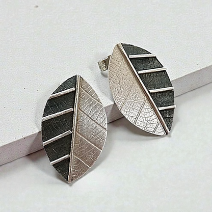 Sterling silver leaf stud earrings.