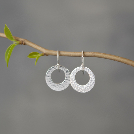 Hammered circle sterling silver earrings.