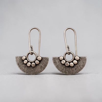 Sterling silver dangle fan earrings.