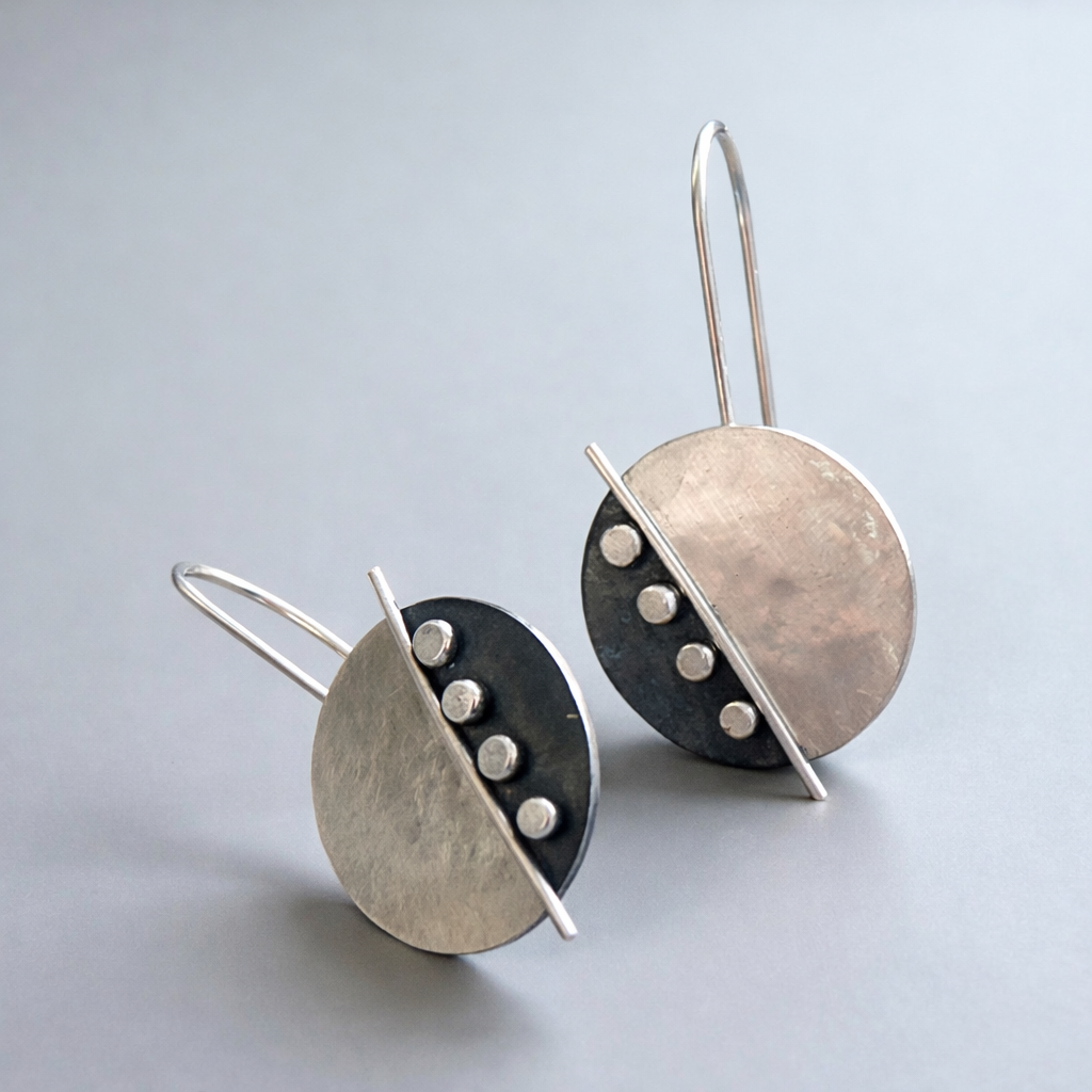Large sterling silver disc earrings.