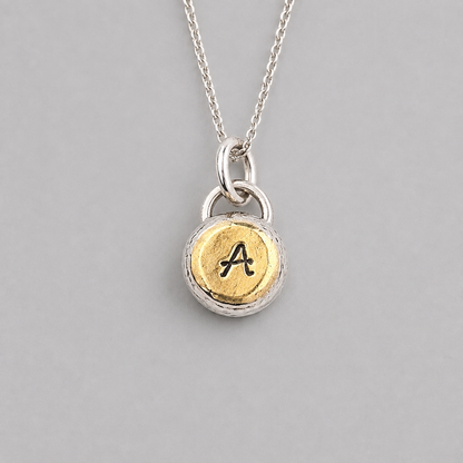 Personalised initial organic sterling silver pebble necklace.
