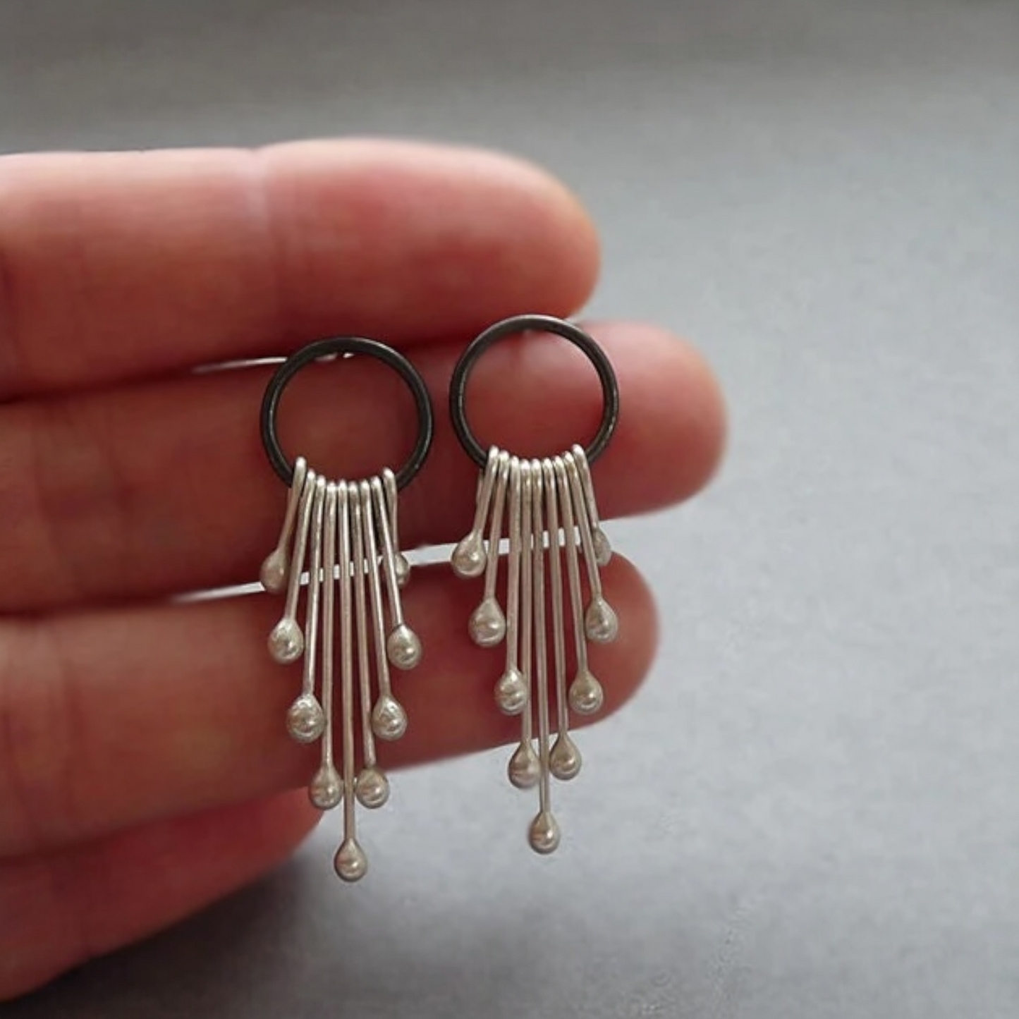 Sterling silver dangle earrings.