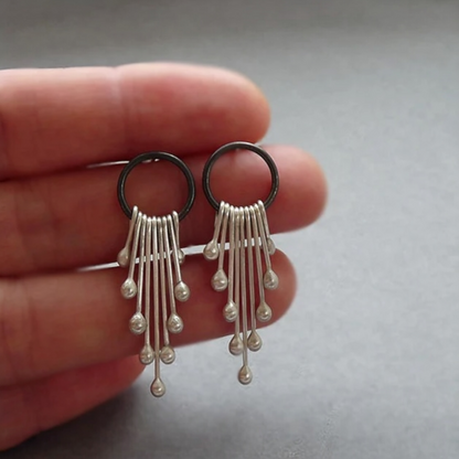 Sterling silver dangle earrings.