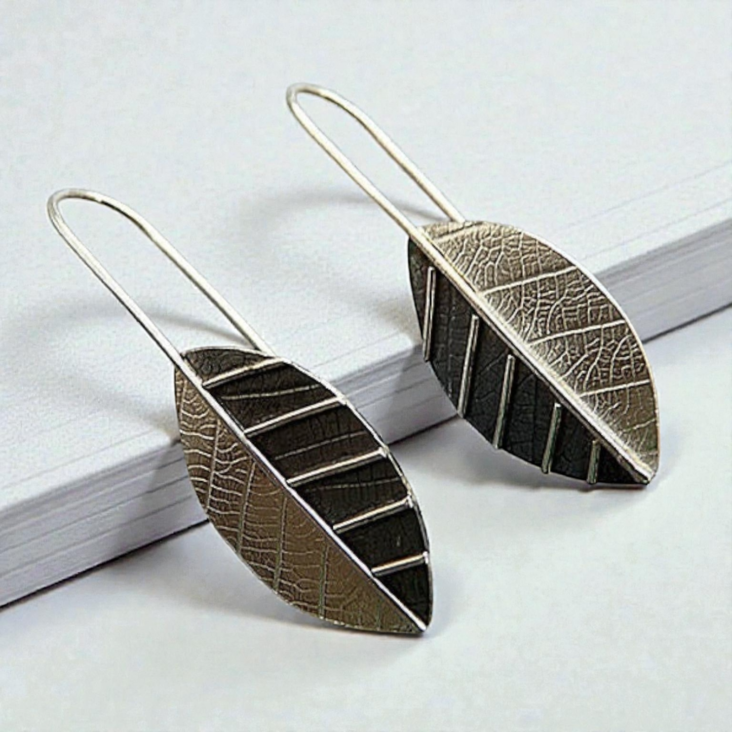 Sterling silver leaf earrings.
