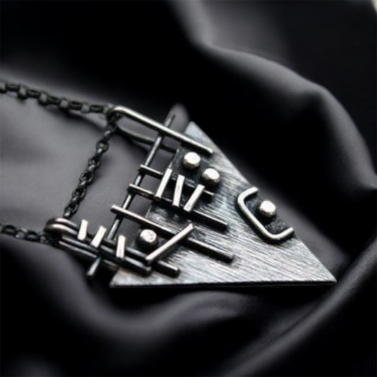Sterling silver triangle necklace.