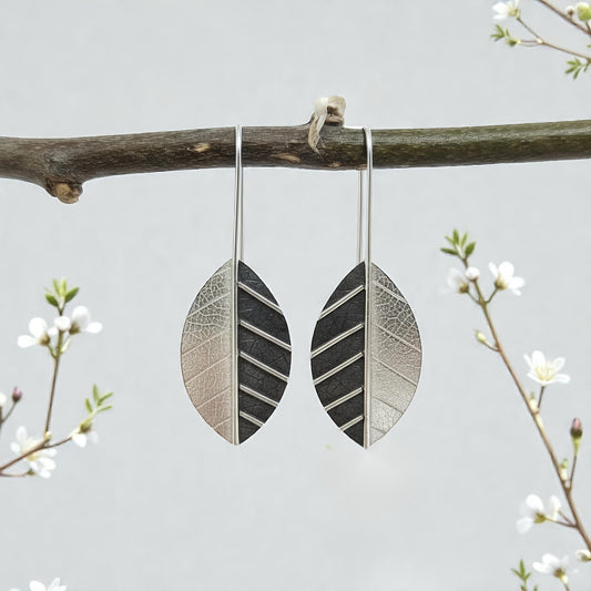Sterling silver leaf earrings.