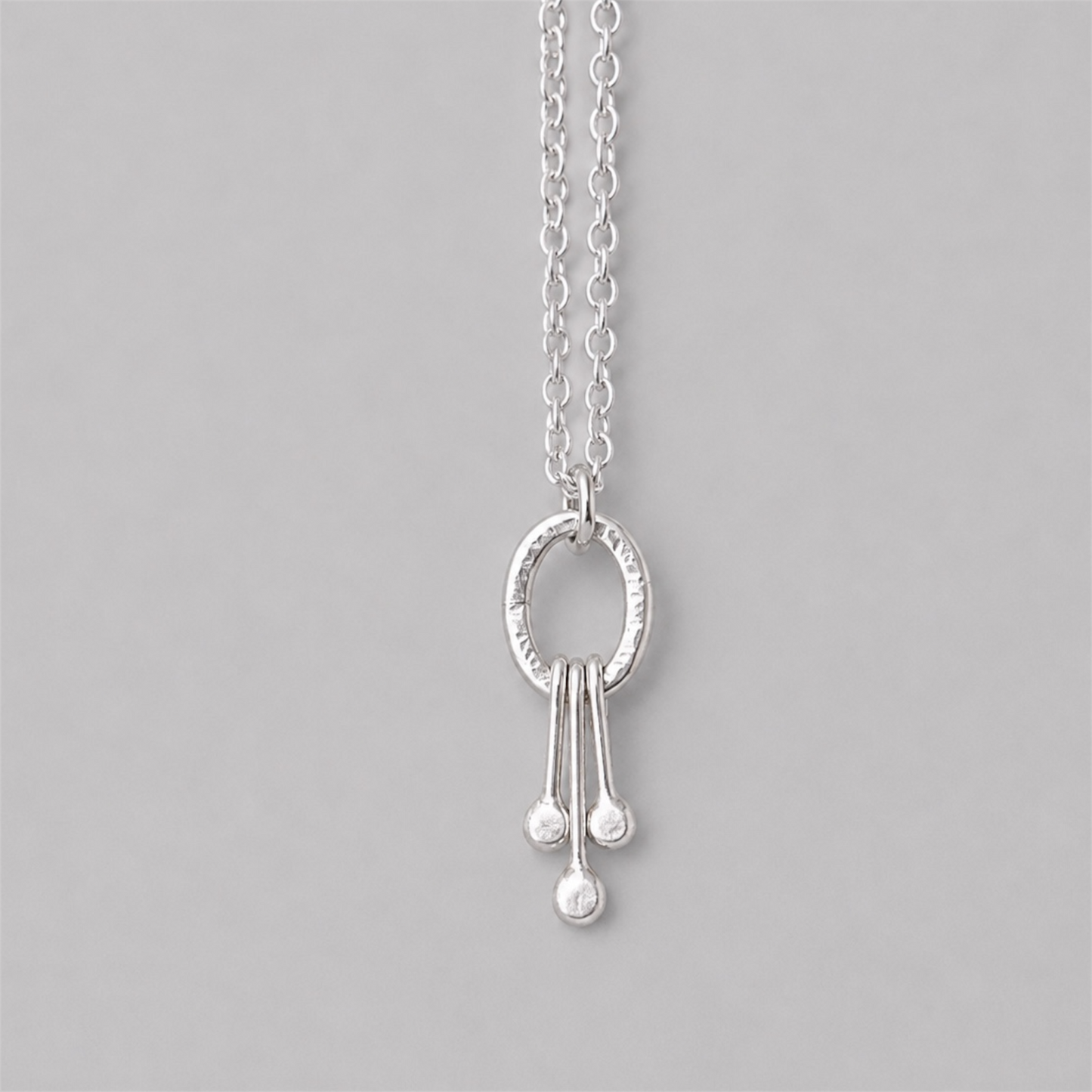 Small sterling silver oval pendant.