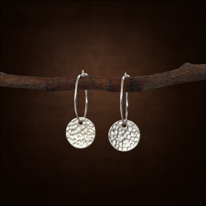 Sterling silver disc charm hoop earrings.